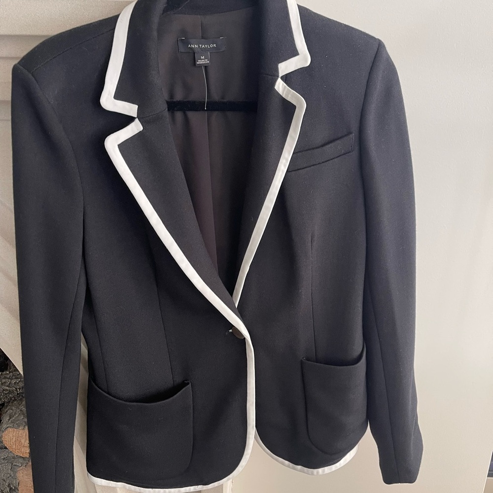 Ann Taylor black blazer with white trim. Excellent condition. Single button